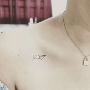 Paper Airplane Collarbone Tattoo