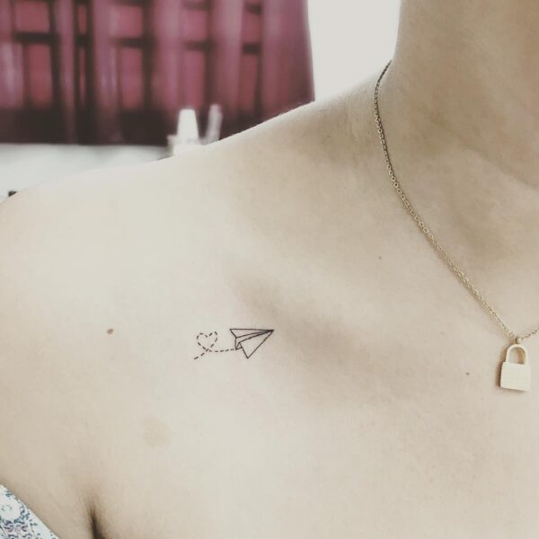 Paper Airplane Collarbone Tattoo