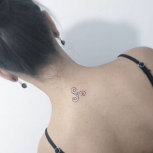 Triskele Base of Neck Tattoo